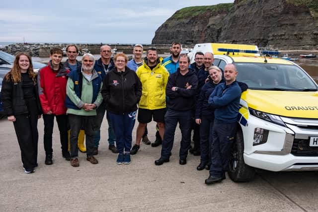 Volunteers from Staithes and Runswick RNLI lifeboat station and officers from HM Coastguard in Staithes.