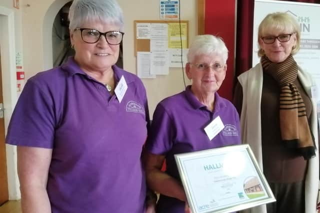 Flamborough Village Hall members Audrey Heywood and Linda James with Kay Parker (ERVHN chair)