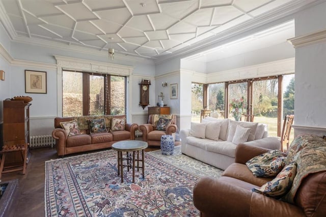 A reception room with lovely period features looks out over the gardens.