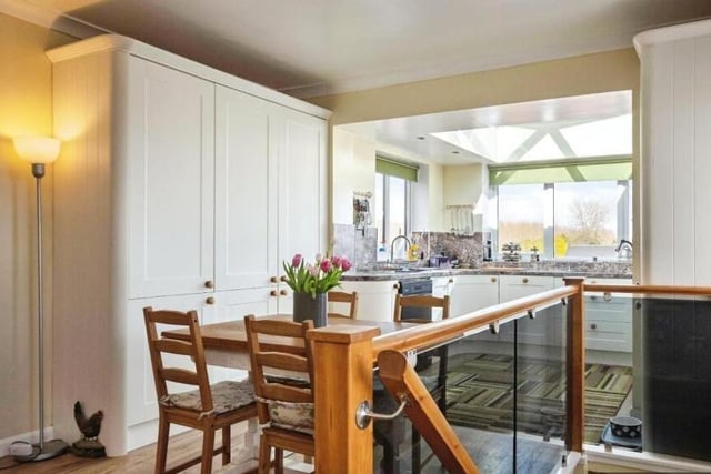 Open plan dining space is linked to the kitchen.