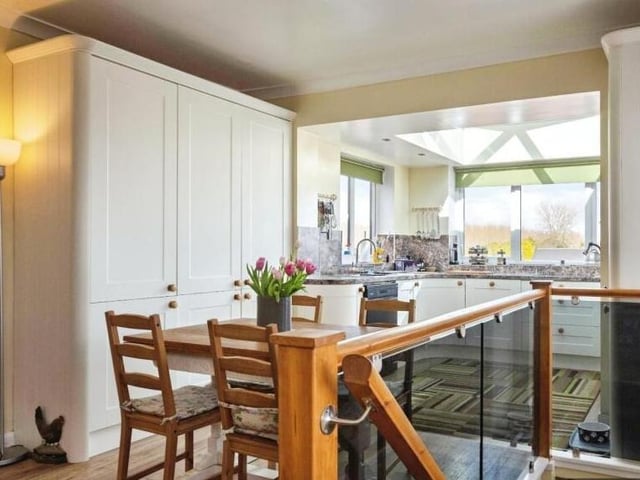 Open plan dining space is linked to the kitchen.