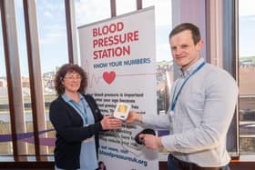 Adele Duffield, outreach librarian, and Andrew Stewart, public health officer, with the new blood pressure monitor in Whitby Library.