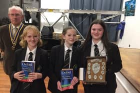 Rotary Club of Whitby & District President, Bob Cameron, presents the winning Caedmon team with their trophy and prizes.