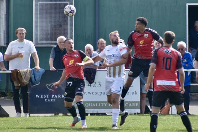 Striker Jake Day gets among the Knaresborough Town defenders. Photo by Alexander Fynn