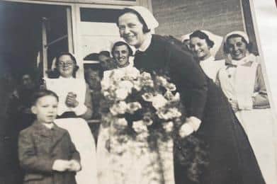 Photo showing Eddie Pickering, aged six, giving matron a bouquet on opening day of Scarborough Hospital.