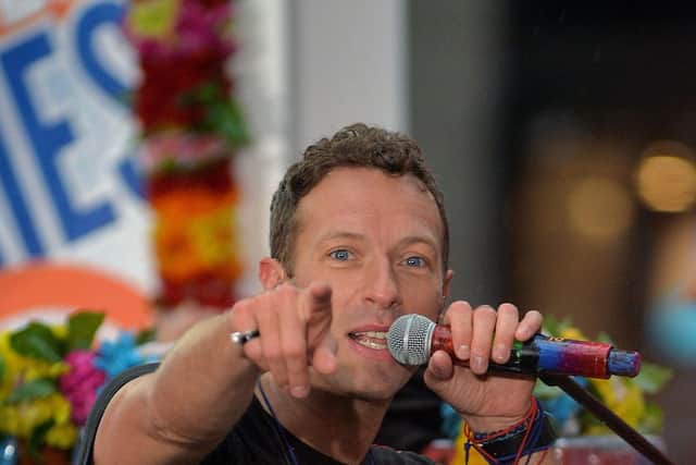 IMPRONTU act: Chris Martin sang for engaged couple. Photo: Getty Images