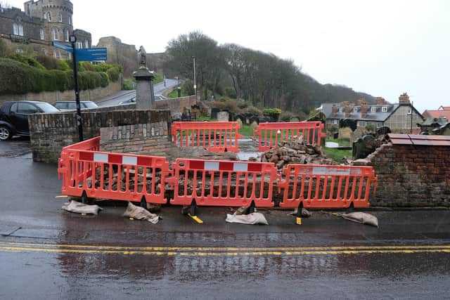 The cemetery wall was badly damaged by a reversing lorry.