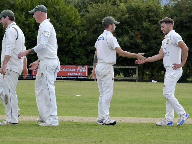 Celebration time for the visitors Flixton 2nds as Seamer lose another wicket
