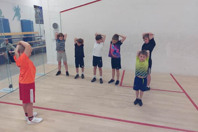 Scarborough Squash Academy stars warm up before their matches.