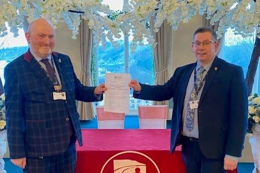 Mark Johnston and Andrew Tunstall show off their Disability Confident certificate