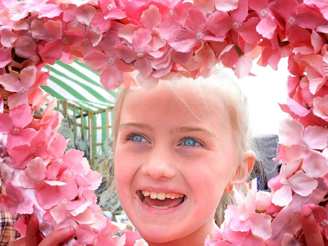 Viewing the flower designs on show.
