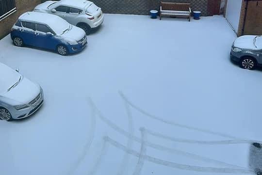 A snowy carpark.