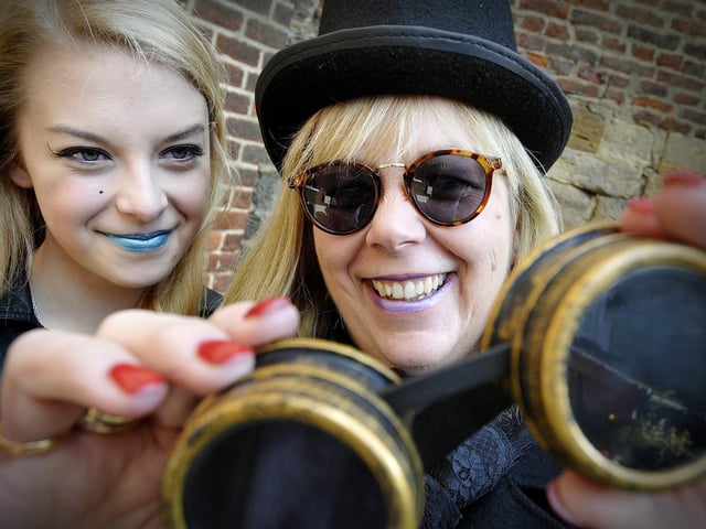 Lucy Eastwood and mum Judy check their specs. 144430n