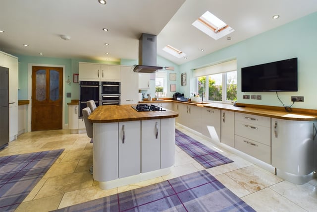 A bright and spacious breakfast kitchen with central island.