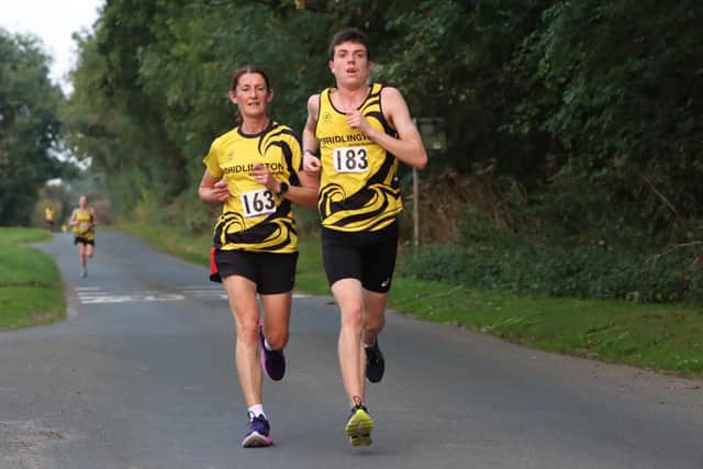 Clare Gummerson, who won the Ladies Trophy, chases down Micah Gibson.