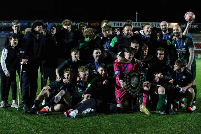 Newby celebrate their cup final win at the Flamingo Land Stadium.