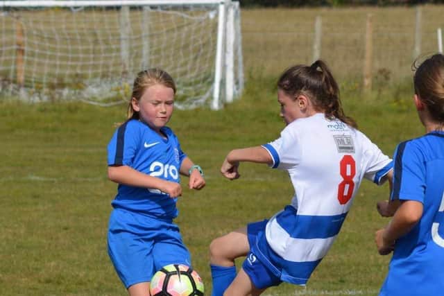 Heslerton U11s Girls Fireworks (blue) take on Driffield (blue and white) Photo: Cherie Allardice.