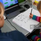 A youngsters does her Maths studies in her bedroom. Photo by Gareth Copley/Getty Images