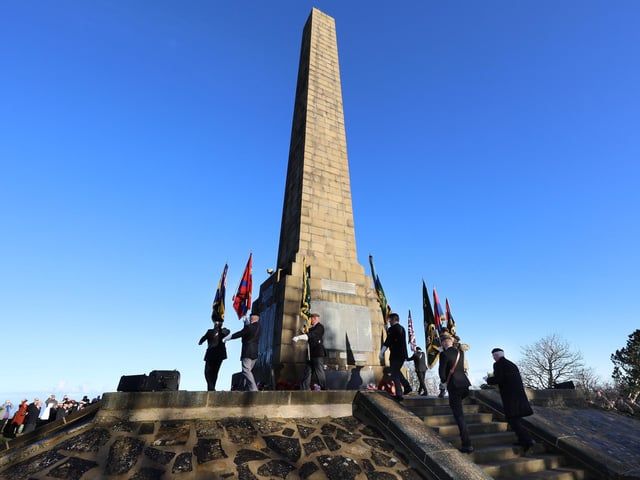 The Standard Bearers make their way to the memorial