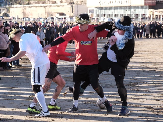 Traditionally the teams play in red and white ...and top hats...