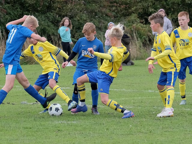 A midfield battle in Seamer Under-12s v Heslerton Under-12s