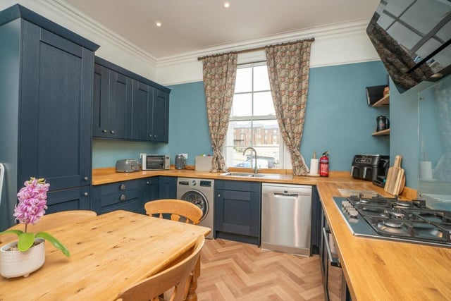 The property's spacious breakfast kitchen has fitted units and integrated appliances.