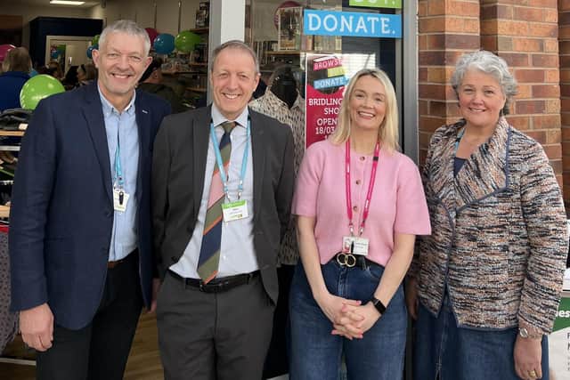 Dove House trustees Jim Harris and Sally Booker with Chris Sadler (chief executive) and Jennifer Rowan (head of retail).