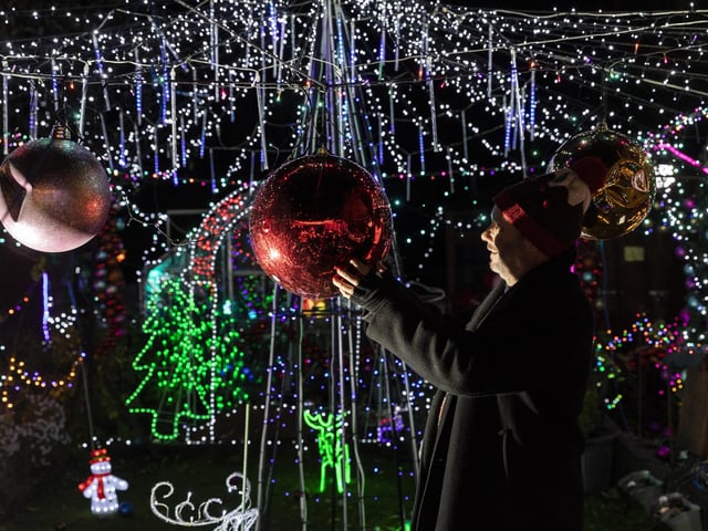 Nigel Watkinson in his illuminated garden.