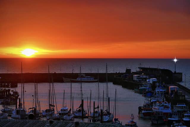 Dawn breaks over Bridlington Harbour, by Aled Jones.