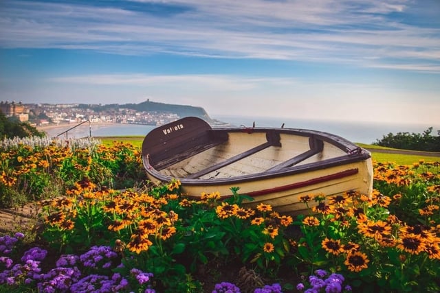 A boat with a stunning Scarborough back drop.