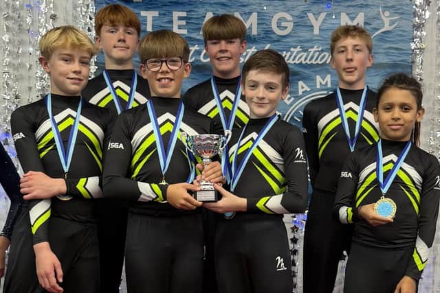The SGA Level 4 Boys show off their medals and trophy.