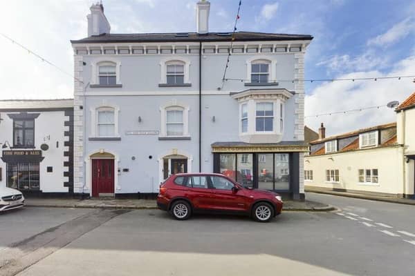 The penthouse apartment is for sale within an attractive building in the centre of Flamborough.