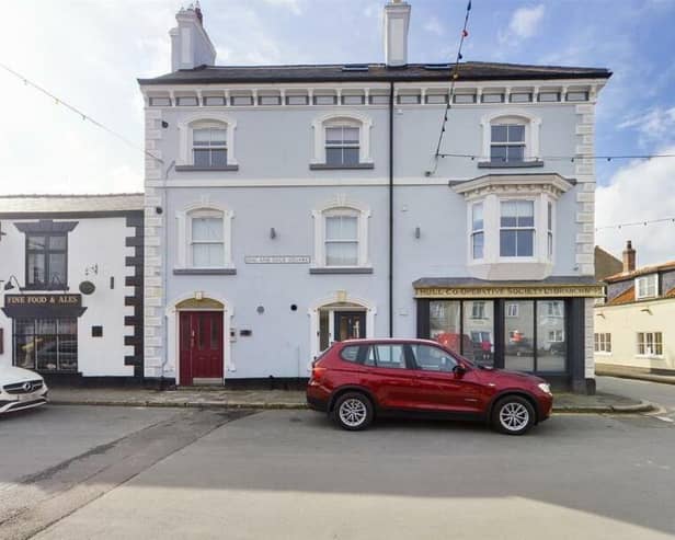 The penthouse apartment is for sale within an attractive building in the centre of Flamborough.