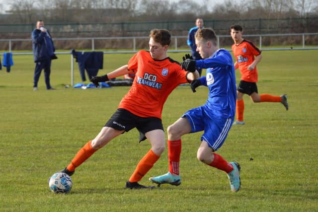 Heslerton Under-16s (orange kit) lost out 1-0 to F1 Racing