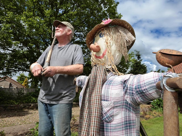 Gardening with a scarecrow
