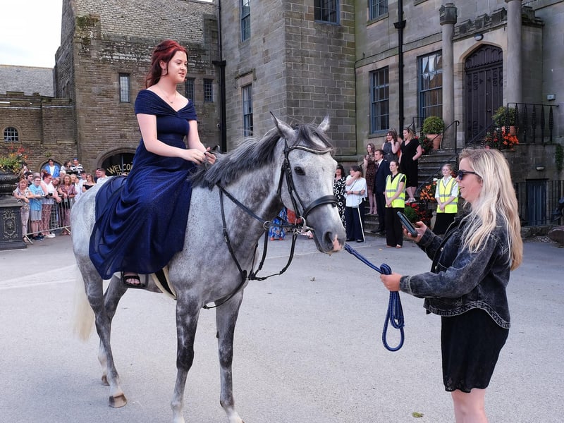 A stylish arrival on horseback.