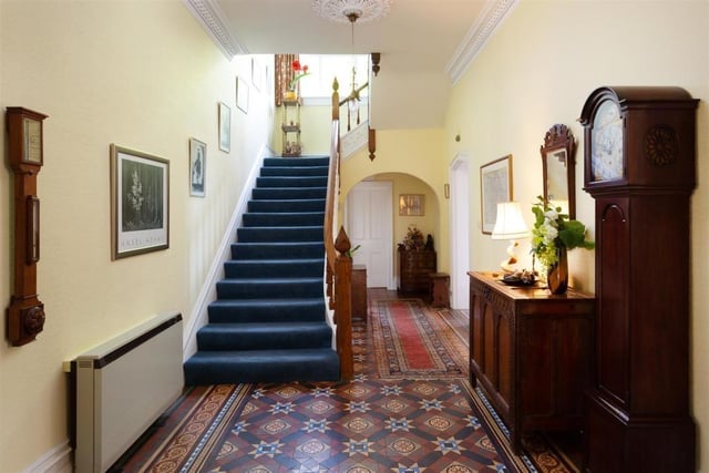 A welcoming hallway with staircase to the first floor.