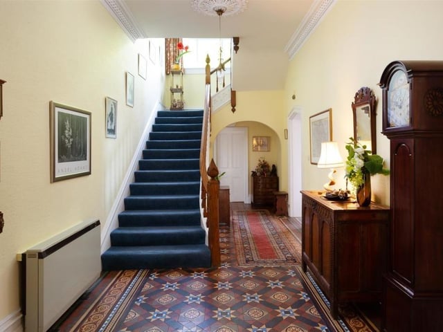A welcoming hallway with staircase to the first floor.