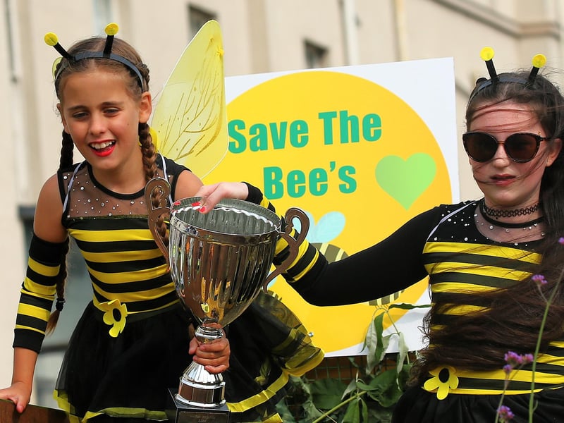 A trophy for Save for Bees in the parade.