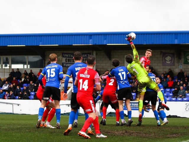 The visitors put the home keeper under pressure from a corner.