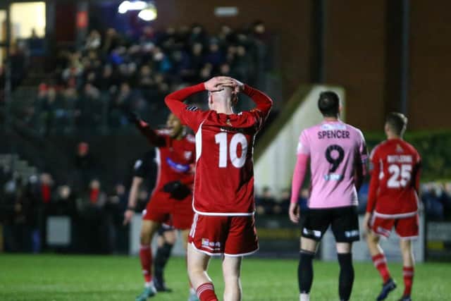 Harry Green, no 10, shows his disappointment after another missed chance for Boro.