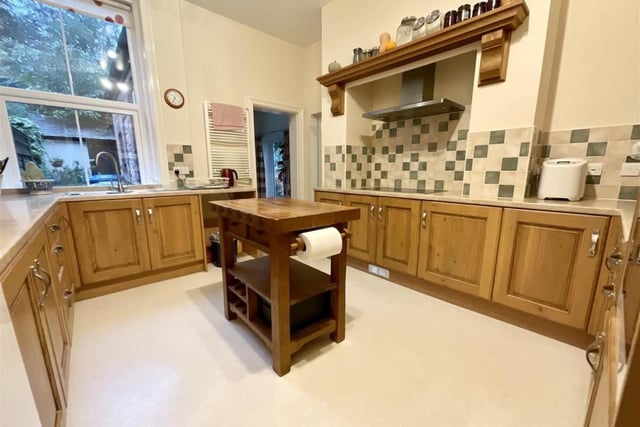 A bright and roomy fitted kitchen has plenty of storage space.