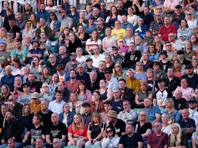 The crowd looks on