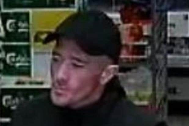 CCTV image of a man police want to speak to following a theft at the Spar shop at Four Lane Ends, Whitby.