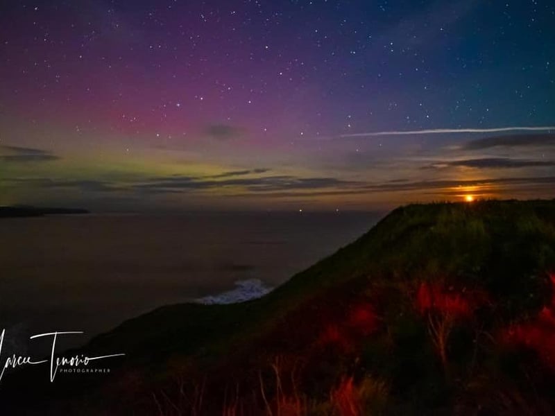 Northern lights and the start of the moon rising, by Marcee Tenario.