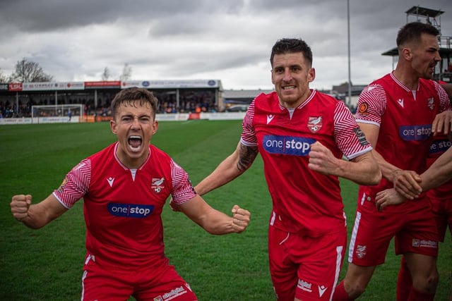 Lewis Maloney, left, leads the Boro celebrations along with skipper Michael Coulson, at Chorley after the dramatic 3-2 win on Monday.