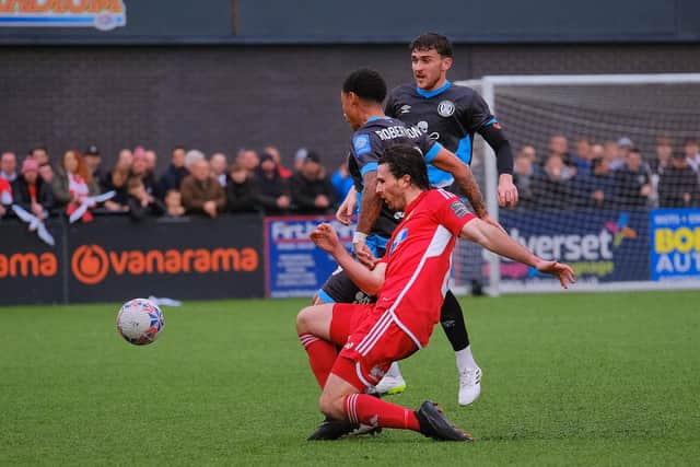 Boro midfielder Alex Purver gets stuck in.