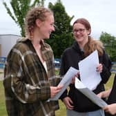 St Augustine's School students Emma Brown, Lucy Raven and Olivia Redfern discuss their results.