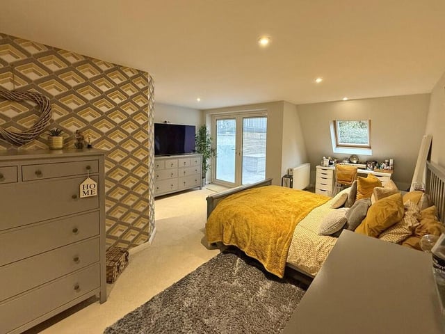 Another of the large bedrooms, with access to the garden.