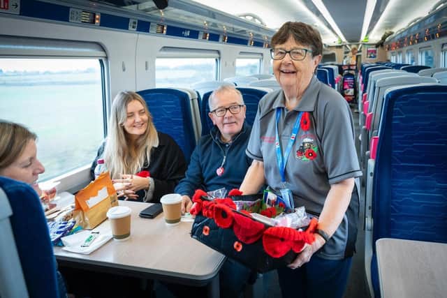 Barbara sells poppies on one of the trains.